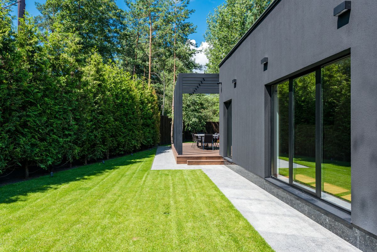 A freshly painted upscale home exterior in warm evening light